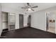 Bedroom showcasing neutral walls, mirrored closet doors, and convenient ensuite bathroom access at 3106 S Extension Rd, Mesa, AZ 85210