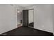 This bedroom features neutral walls and carpeting and a closet with mirrored doors at 3106 S Extension Rd, Mesa, AZ 85210