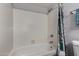 This tiled shower features a new shower head and soap dish, next to the toilet at 3106 S Extension Rd, Mesa, AZ 85210