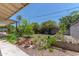 Spacious backyard features a mix of hardscape and green space with mature landscaping at 323 E Griswold Rd, Phoenix, AZ 85020