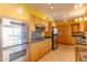 Modern kitchen with stainless steel appliances, granite countertops, and ample storage space at 323 E Griswold Rd, Phoenix, AZ 85020