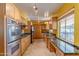 Spacious kitchen featuring modern appliances, ample counter space, and generous cabinet storage at 323 E Griswold Rd, Phoenix, AZ 85020