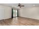 Bright bedroom with wood-look floors and French doors leading to the pool area at 3255 E Malapai Dr, Phoenix, AZ 85028