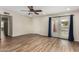 This bedroom features stylish wood-look floors and a ceiling fan at 3255 E Malapai Dr, Phoenix, AZ 85028