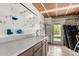 An organized garage includes pegboard, shelving, and neutral countertop space at 3255 E Malapai Dr, Phoenix, AZ 85028