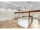 Bright kitchen with an island, light wood floors and ample counter space at 3255 E Malapai Dr, Phoenix, AZ 85028