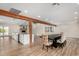 Open-concept living space featuring wood floors and seamless transition to the kitchen at 3255 E Malapai Dr, Phoenix, AZ 85028