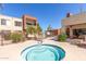Community hot tub with lounge chairs and condo buildings, perfect for relaxation at 3500 N Hayden Rd # 1603, Scottsdale, AZ 85251