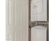 This laundry area features a stacked washer and dryer at 3500 N Hayden Rd # 1603, Scottsdale, AZ 85251