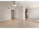 Living area with tile flooring and ceiling fan transitioning to the kitchen at 3500 N Hayden Rd # 1603, Scottsdale, AZ 85251
