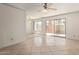 Open floor plan with tile flooring, ceiling fan, and sliding glass door to the outdoors at 3500 N Hayden Rd # 1603, Scottsdale, AZ 85251