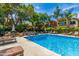 Beautiful community swimming pool with lounge chairs, tables, and well-maintained landscaping at 3500 N Hayden Rd # 1603, Scottsdale, AZ 85251