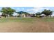 A wide view of the community playground and green space at 38115 W Excussare Way, Maricopa, AZ 85138