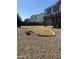 Large backyard featuring a grassy area surrounded by decorative rock landscaping at 4151 E Campbell Ave, Gilbert, AZ 85234