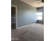 Spacious carpeted bedroom featuring ceiling fan and natural light at 4151 E Campbell Ave, Gilbert, AZ 85234