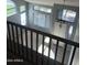 Sunlit foyer featuring tile flooring and a view of the front door from the second floor at 4151 E Campbell Ave, Gilbert, AZ 85234