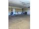 Spacious garage featuring a utility sink and ample room for vehicles or storage at 4151 E Campbell Ave, Gilbert, AZ 85234