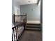 Carpeted hallway with a wood banister and gray walls for a modern aesthetic at 4151 E Campbell Ave, Gilbert, AZ 85234
