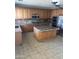 Well-appointed kitchen featuring stainless steel appliances, granite countertops, and custom cabinetry at 4151 E Campbell Ave, Gilbert, AZ 85234