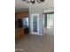 Modern kitchen featuring stainless steel appliances, granite countertops, and seamless access to the front entrance at 4151 E Campbell Ave, Gilbert, AZ 85234