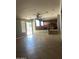 Expansive living room with tile flooring, abundant natural light, and seamless access to the kitchen area at 4151 E Campbell Ave, Gilbert, AZ 85234