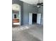 Spacious main bedroom with a ceiling fan and an ensuite bathroom with wood cabinets at 4151 E Campbell Ave, Gilbert, AZ 85234