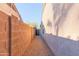 Side yard with a gravel path and block wall for added privacy at 4611 E Red Bird Rd, Cave Creek, AZ 85331
