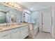 Bright bathroom featuring double sinks, ample counterspace, neutral walls, and a soaking tub at 4611 E Red Bird Rd, Cave Creek, AZ 85331