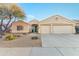 Charming desert home featuring low-maintenance landscaping, a two-car garage, and a welcoming front porch at 4611 E Red Bird Rd, Cave Creek, AZ 85331