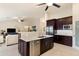 Modern kitchen with a large island, stainless steel appliances, and seamless flow into the living area at 4611 E Red Bird Rd, Cave Creek, AZ 85331