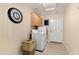 Neat laundry room with front-loading washer and dryer, plus ample cabinet storage at 4611 E Red Bird Rd, Cave Creek, AZ 85331