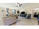 Open living room with tile floors, a ceiling fan, neutral paint, and plush furniture at 4611 E Red Bird Rd, Cave Creek, AZ 85331
