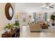 Inviting living room with neutral tones, tile floors, backyard access, and stylish furnishings at 4611 E Red Bird Rd, Cave Creek, AZ 85331