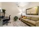 Cozy office area with seating, desk, neutral walls, and artwork at 4611 E Red Bird Rd, Cave Creek, AZ 85331