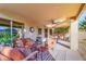 Inviting covered patio featuring stylish outdoor furniture and ceiling fan at 4611 E Red Bird Rd, Cave Creek, AZ 85331