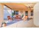 Comfortable covered patio with an outdoor seating arrangement and ceiling fan at 4611 E Red Bird Rd, Cave Creek, AZ 85331