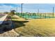 Scenic view of the community amenities, including pickleball court and playground at 46922 W Coe St, Maricopa, AZ 85139