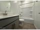 Modern bathroom with a tub, sleek vanity, and stylish tile flooring at 46922 W Coe St, Maricopa, AZ 85139