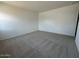 Neutral bedroom featuring soft carpet, blank canvas walls, and comfortable interior at 46922 W Coe St, Maricopa, AZ 85139