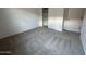 Spacious bedroom with new carpeting, white walls, and ample closet space at 46922 W Coe St, Maricopa, AZ 85139