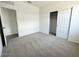 Cozy bedroom with plush carpeting, closet, and two doors for flexible use of space at 46922 W Coe St, Maricopa, AZ 85139