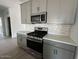 Updated kitchen with stainless steel appliances, gas range, and modern cabinetry at 46922 W Coe St, Maricopa, AZ 85139