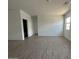 Expansive living room featuring neutral-toned tile flooring that complements any design style at 46922 W Coe St, Maricopa, AZ 85139