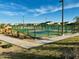 Active community offers pickleball courts, sidewalks and landscaping with beautiful sky background at 46922 W Coe St, Maricopa, AZ 85139