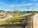 Community pickleball courts with covered seating, playground, sidewalks, and landscaping at 46922 W Coe St, Maricopa, AZ 85139
