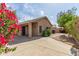 The backyard features a covered patio, mature landscaping, and a walkway at 5336 W Campo Bello Dr, Glendale, AZ 85308
