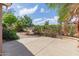 A backyard patio featuring mature landscaping, and a block fence at 5336 W Campo Bello Dr, Glendale, AZ 85308