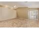 Spacious bedroom featuring tiled floors, neutral paint, and sliding glass doors at 5336 W Campo Bello Dr, Glendale, AZ 85308