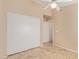 Bedroom features tile floors, large sliding door closet, and access to other rooms at 5336 W Campo Bello Dr, Glendale, AZ 85308