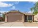 Charming single-story home featuring a tile roof, two-car garage and landscaped front yard at 5336 W Campo Bello Dr, Glendale, AZ 85308